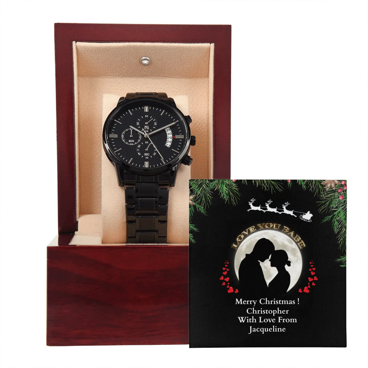 Black wristwatch in a wooden box with a Christmas card featuring a couple's silhouette.