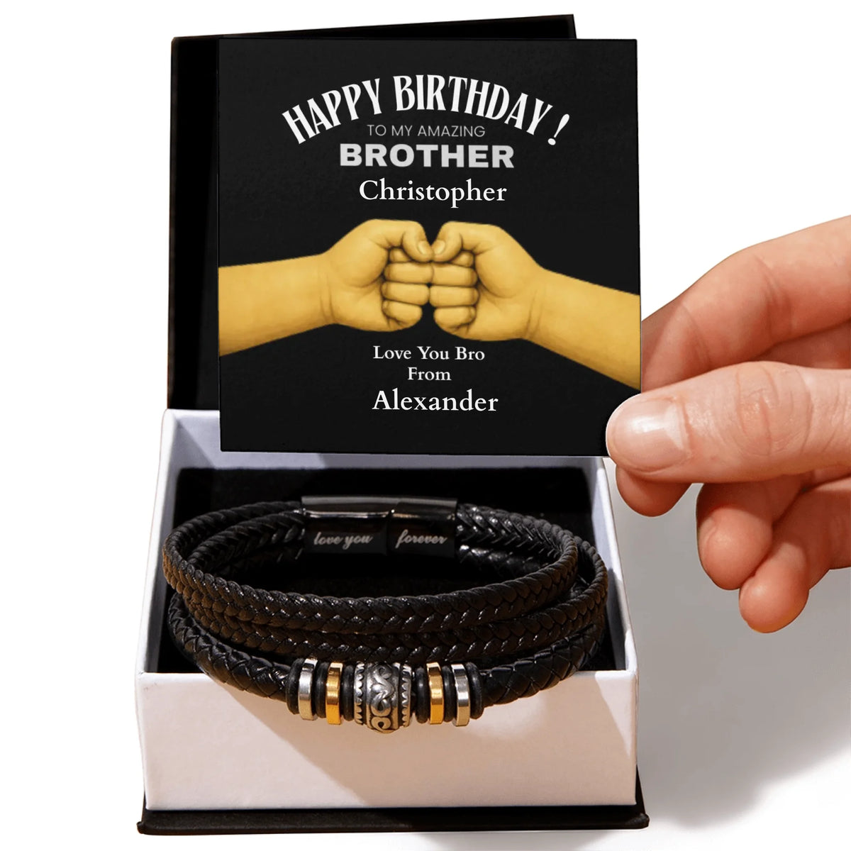 Black leather bracelet with metal charms in a box with a personalized birthday card.