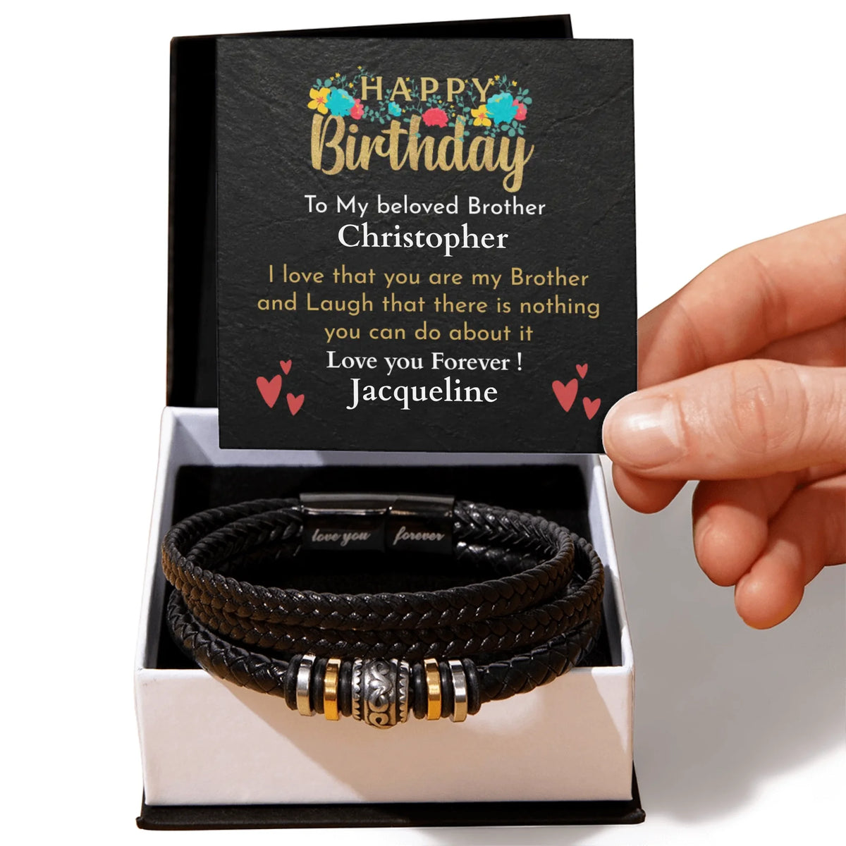 Black leather bracelet with charms in a box with a personalized birthday card.