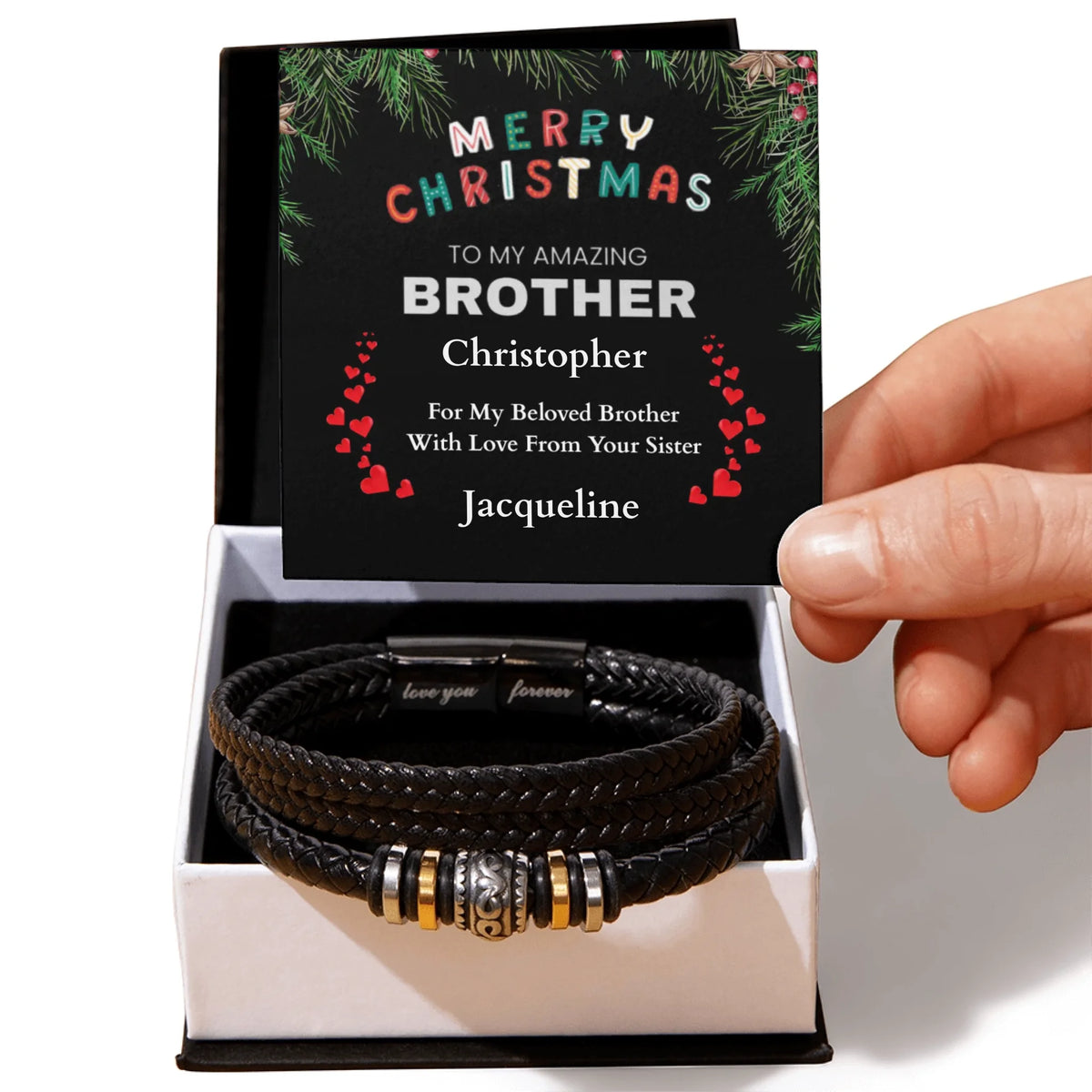 Black leather bracelet with charms in a box with a personalized birthday card for a son.