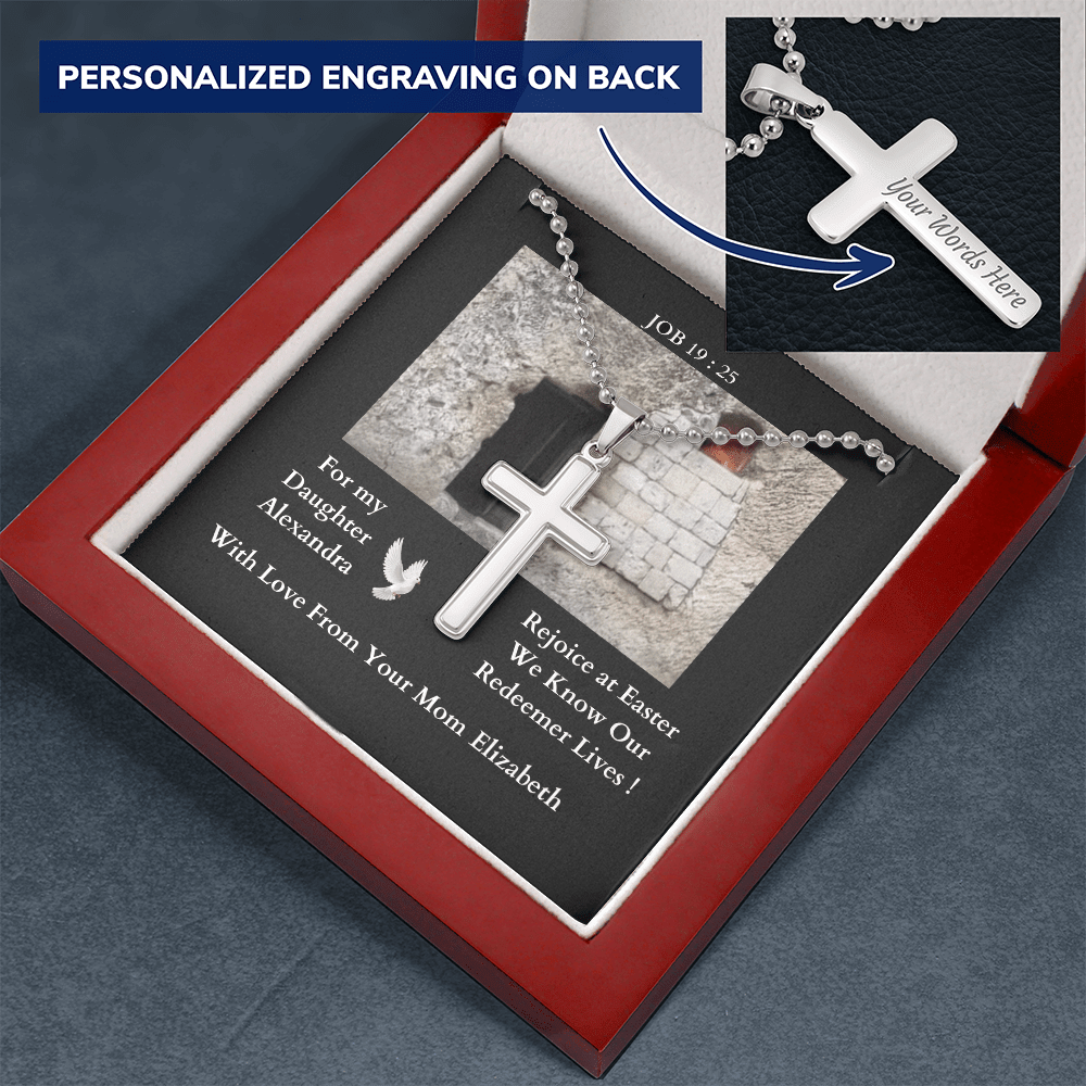 polished-stainless-steel-christian-cross-with- military-style-ball-chain-necklace-in-led-lit-mahogany-jewelry-gift-box-with-arrow-pointing-to-how-the-cross-can-be-engaved-with-message-on-its-back.